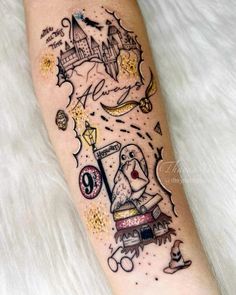 a person with a tattoo on their leg that has an image of a castle in it