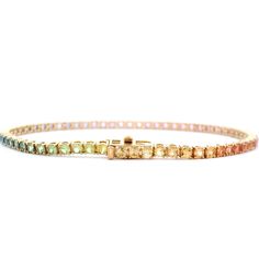 Indulge in the poetic beauty of this exquisite 5.31 Cts. Pastel Rainbow Sapphire Tennis Bracelet. With a dreamy palette of pastel sapphires, this premium piece exudes elegance and grace. Perfect for adding a touch of luxury to any outfit, this bracelet is a must-have for any jewelry collection. GEMS 5.31 RD TCW 65 PCS. RAINBOW18K YG 8.92 GRAMS SIZE 7" MD-104 Dreamy Palette, Rainbow Sapphires, Pastel Rainbow, Tennis Bracelet, Jewelry Collection, Tennis, Sapphire, Gems, Size 7