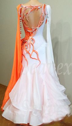 an orange and white ballroom dress on display