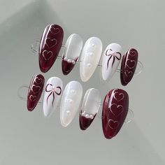 These are hand made, high quality, gel x press on nails. Each nail is meticulously painted and designed to provide salon quality manicure at home. With the right application, these nail tips can last up to two weeks and are easy to remove with warm soapy water.  📬Free tracked shipping on all orders over $55! Please see shipping info for more details on domestic and international shipping.  ❣️Style Description:  - Medium almond shape - Red and white Coquette design 📦What is included:  - Each set includes a full set of 10 press-on nails and a starter kit - The starter kit includes alcohol pads, cuticle pusher, mini nail file and a sheet of adhesive tabs (24 pieces)   ❕Please Note:  - Measure your nails before making an order as the correct size is crucial for a natural looking application. Red And White Coquette, Red Coquette Nails, Simple Red Nails, Festive Holiday Nails, Coquette Design, White Coquette, Almond Press On Nails, Coquette Nails, Alcohol Pads