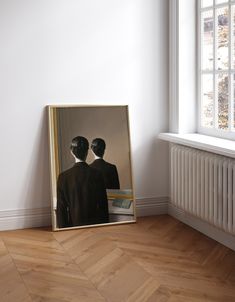 an image of two people standing in front of a mirror that is on the floor