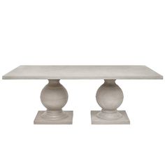 a white table with two grey vases on each side and one is standing up