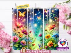 three colorful candles with flowers and butterflies on them