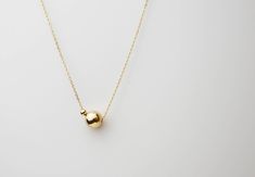 "Minimalistic, classy and elegant! This necklace is perfect for any occasion. Shinny Beads in sterling silver or gold filled. A perfectly Shinny ball bead pendants threated on a delicate feminine 14K gold filled chain. Simple and dainty gold ball necklace, featuring 14K gold filled ball and chain /Sterling silver ball and chain. ■ Turn this necklace also a Back necklace! Check out our clip on Back Necklace Chain : https://www.etsy.com/listing/250871895/mini-bead-back-necklace-dainty-beck-drop?re Necklaces Modern, Gold Ball Necklace, Classy Necklace, Dainty Necklaces, Dot Necklace, Real Gold Jewelry, Back Necklace, Etsy Bridesmaid Gifts, Ball Necklace