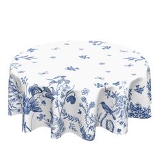 a blue and white table cloth with birds on it