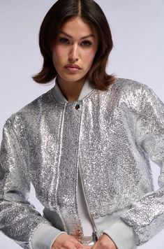 SPECIAL EDITION SILVER TEXTURED BOMBER Fitted Contrast Sequin Outerwear For Fall, Fall Fitted Outerwear With Contrast Sequin, Fitted Glitter Long Sleeve Outerwear, Fitted Long Sleeve Glitter Outerwear, Glitter Fitted Outerwear For Party Season, Trendy Spring Outerwear With Contrast Sequin, Metallic Disco Outerwear For Spring, Winter Glitter Long Sleeve Outerwear, Spring Glitter Long Sleeve Outerwear