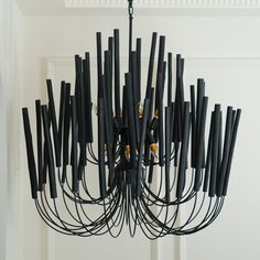 a black chandelier hanging from the ceiling