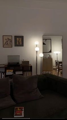 a living room filled with furniture and lamps