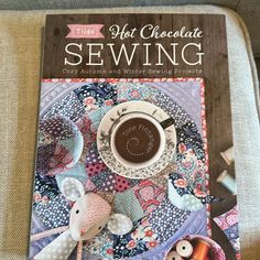 a book with an image of a cup of coffee on top of it and the title, quilts not chocolate sewing cozy autumn and winter sewing projects