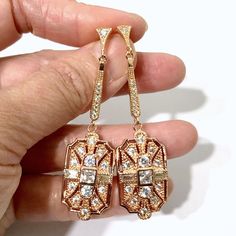 "A 1920s vintage style bridal jewelry set featuring Art Deco Gatsby wedding necklace and geometric dangle cz earrings on sterling silver posts, made of sparkly clear cubic zirconia with silver rhodium white or yellow or rose gold plated bail and chain. Earrings are about 2 1/4\" (5.7cm) with sterling silver posts. Pendant is 1 5/8\" (4.3cm) long with bail. Chain length can be added with a 2\" extender chain. Matching brooch pin at https://etsy.me/2Wk6HzE View matching pieces or similar designs a Art Deco Formal Earrings Hallmarked, Formal Art Deco Jewelry With Vintage Charm, Art Deco Multi-stone Wedding Jewelry, Silver Art Deco Bridal Earrings With Dangle Shape, Art Deco Chandelier Earrings, Dangle Style For Wedding, 1920s Jewelry, Rose Gold Bridal Earrings, Vintage Wedding Jewelry, Bridal Earrings Drop