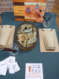 the table is set up with rocks, paper towels and other items to make an activity