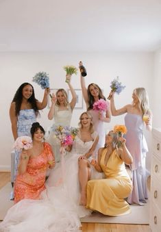 a group of bridesmaids posing for a photo