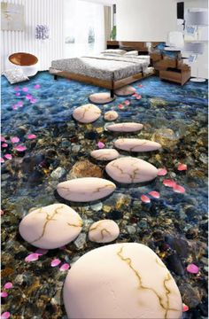 the floor is covered in water and pink flowers, while it's surrounded by rocks