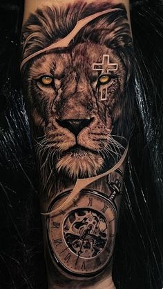 a man's arm with a lion and clock tattoo on the side of his leg