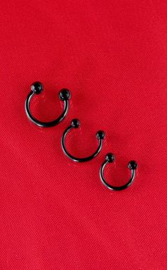 Expertly crafted from titanium, this septum ring features a sleek black finish and is designed to be lightweight and gentle on sensitive skin. Material: Titanium. Type: Horseshoe Ring. Gauge: 14G & 16G. Length: 14G: 10mm. 16G: 8mm or 10mm. Colour: Black. Also available in Gold. Suitable Piercing: Ears, Nose, Eyebrow, Lip or Septum. Horseshoe Ring, Witchy Jewelry, Ring Black, Body Jewellery, Black Rings, Septum Ring, Sensitive Skin, Sleek, Ring