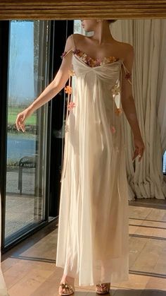 Ethereal Evening Spring Dresses, Ethereal Evening Dresses For Spring, Ethereal Spring Party Dresses, Spring Party Ethereal Dresses, Ethereal Sleeveless Party Dress, Beige Sleeveless Dress With Delicate Straps, Ethereal Beach Dress For Spring, Ethereal Spring Beach Dress, Feminine Summer Evening Maxi Dress