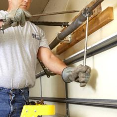 a man working on pipes in a garage