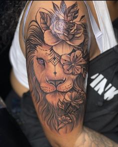 a woman with a lion tattoo on her arm