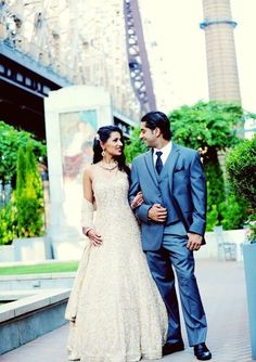 a bride and groom standing next to each other