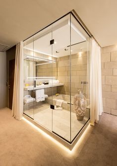 a bathroom with a large glass enclosed shower