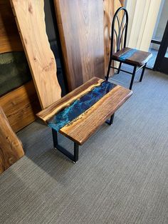 two chairs and a table in a room with carpeted flooring on the ground