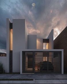 a car is parked in front of a modern house