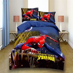 a spiderman bed set with blue sheets and pillows