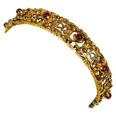 Art Nouveau Ruby ​​Diamond 18K Gold Bracelet, Paris circa 1890 This very decorative gold bracelet consists of massive, openwork floral and finely chiseled links, which are set with 10 bright red ruby ​​cabochons and rose cut diamonds. Signed with a Paris master's mark. 18K yellow gold 10 rubies as round cabochons 10 rose cut diamonds Size 18 cm long, 1 cm wide Weight 33.8 g stamped with a Parisian eagle head mark for 18K gold. Maker's mark LG Very good condition, only minimal signs of wear with 18k Gold Bracelet, Antique Bracelets, Gold Armband, Medieval Jewelry, Big Diamond, Eagle Head, A Paris, Antique Diamond, Women Diamond