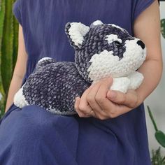 a person holding a stuffed animal in their hands