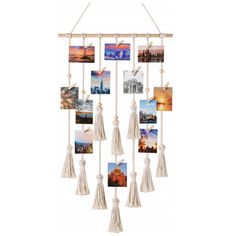 a hanging photo collage with tassels and pictures on the bottom, in white