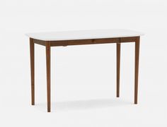 a table with a white top and wooden legs