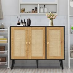 the cabinet is made out of wood and has two doors that open to reveal shelves