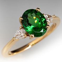 a green ring with three diamonds around it