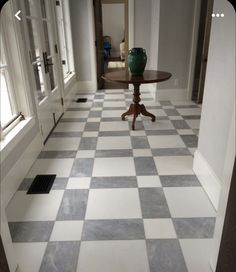 a checkered floor with a table in the middle