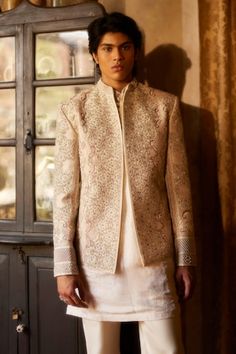 Ivory jacket featuring dabka zari embroidered abstract motifs highlighted by bead and pearl embellishments. Comes with self design inner kurta and pant. - Aza Fashions Fitted White Sherwani For Spring, White Fitted Sherwani For Spring, White Long Sleeve Bandhgala For Spring, Cream Bandhgala With Intricate Embroidery Long Sleeve, White Sherwani With Intricate Embroidery For Spring, Formal White Embroidered Outerwear, Elegant White Sherwani For Spring, Beige Long Sleeve Bandhgala With Intricate Embroidery, White Embroidered Outerwear For Fall