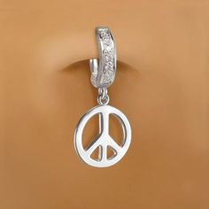 Solid silver belly ring with a cute silver peace sign dangle charm. The belly ring features seven stunning clear CZs that are pave set into the clasp. Fixed to the bottom of the belly ring is a sterling silver peace sign charm.We take our time making our naval rings so it can come out perfect for you our costumers .We want you to feel special when you wear one of the belly rings. when we make our body jewelry we make them with love and the best material we can so they can last longer and be some Symbolic Silver Jewelry With Peace Sign, Silver Dangle Belly Rings Nickel Free, Nickel-free Silver Dangle Belly Rings, Silver Hypoallergenic Dangle Belly Rings, Hypoallergenic Silver Dangle Belly Rings, Nickel-free Dangle Belly Rings In Sterling Silver, Nickel Free Sterling Silver Dangle Belly Rings, Nickel-free Sterling Silver Dangle Belly Rings, Belly Piercing Ideas