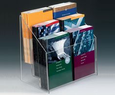 a clear acrylic book holder holds several books