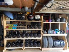 a garage filled with lots of different types of pots and pans on wooden shelves