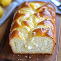 a loaf of lemon bread on a cutting board