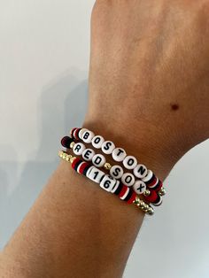 ⚾BASEBALL SEASON IS HERE If you are a Boston Red Sox fan, what better way to support your team than with one of these bracelets?  ⚾These trendy bracelets are the perfect gift for a teacher, girlfriend, wife, friend, and yourself!  Buy one bracelet or buy all three to create a stack.   ⚾Bracelets are made with 4mm gold plated round beads, 7mm acrylic round alphabet beads, 6mm heishi disc beads, and square number beads. ⚾️For Number Bead Bracelet orders, please click on the "Personalization" box to enter the Jersey Number you want for your bracelet. ⚾Bracelet Care: *Roll bracelets on and off. *String is stretchy elastic. Please be mindful not to stretch too much. *Keep bracelets dry and away from fragrance sprays/soaps. *Bracelets will come in secure plastic packaging. Feel free to keep brac Red Team Spirit Bracelets For Gifts, Adjustable Red Bracelets For Sports Events, Red Personalized Bracelets For Team Spirit, Red Team Spirit Bracelets For Sports Events, Personalized Red Bracelets For Team Spirit, Red Personalized Bracelets With Team Spirit Style, Sporty Red Jewelry For Game Day, Sporty Red Wristband For Sports Events, Adjustable Red Sporty Wristband