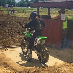 a person on a dirt bike in the dirt