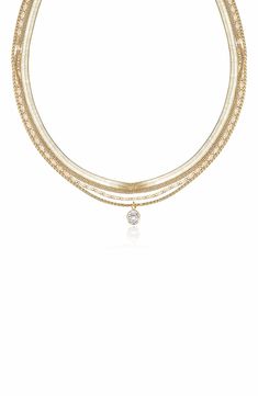 Instantly create a trend-right layered effect with this gold-plated multistrand necklace accented with a single sparkling stone. 16" longest strand length; 14" shortest strand length:5" extender 1/4" pendant diameter Lobster clasp closure 18k-gold plate/cubic zirconia Imported Gold-tone Multi-strand Necklaces For Layering, Multi-strand Figaro Chain Necklaces For Layering, Dainty Multi-strand Layered Necklace With Figaro Chain, Multi-strand Figaro Chain Necklace, Multi-strand Gold Plated Chain Necklace, Multi-strand Gold Chain Necklace For Layering, Multi-strand Figaro Chain Layered Necklace, Gold Multi-strand Clavicle Chain Necklace, Gold-tone Multi-strand Necklace For Layering