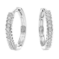 These 14K White Gold Mixable Hoop Earrings feature 22 round cut diamonds, weighing 0.14 CTW. FE2082W Silver Diamond Huggie Earrings With Halo Design, White Diamond Hoop Earrings With Diamond Accents, White Gold Diamond Huggie Earrings With Halo Design, White Gold Diamond Huggie Earrings With Accents, Formal White Gold Huggie Earrings With Halo Design, White Gold Hoop Earrings With Diamond Accents, Small Hoop Diamond Earrings In White Gold For Anniversary, White Gold Small Hoop Diamond Earrings With Pave Setting, White Gold Diamond Hoop Earrings With Diamond Cut