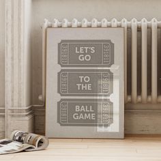 a framed movie poster with the words let's go to the ball game on it