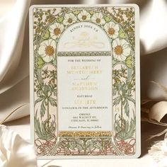 a wedding card with an ornate design on it