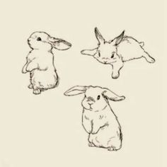 three rabbits sitting next to each other on top of a white sheet with black ink