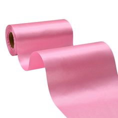 two rolls of pink satin paper on a white background