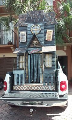 a truck is parked in front of a house