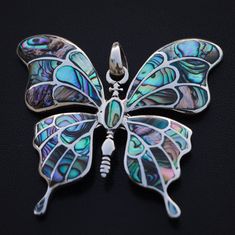 Beautiful Big butterfly silver pendant. Handmade Solid and heavy butterfly decorated with rainbow abalone shells, made from high-quality Sterling Silver 925. Native people have a myth which involves abalone shells being worn on the heads of those girls soon to become women. Not only the native Americans but the use of abalone shell can also be traced in several other native cultures worldwide. Abalone shells have been used since ancient times to increase the receptivity of the divine messages. T Abalone Shell Inlay Jewelry For Gifts, Silver Butterfly Jewelry For Jewelry Making, Unique Butterfly Charm Pendant Jewelry, Iridescent Butterfly-shaped Handmade Jewelry, Handmade Iridescent Jewelry In Butterfly Shape, Handmade Iridescent Butterfly Jewelry, Iridescent Butterfly-shaped Jewelry Gift, Handmade Silver Butterfly Necklace, Iridescent Butterfly Shaped Jewelry Gift