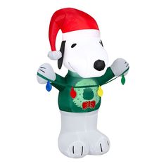 a large inflatable dog with a santa hat and christmas decorations on it's chest